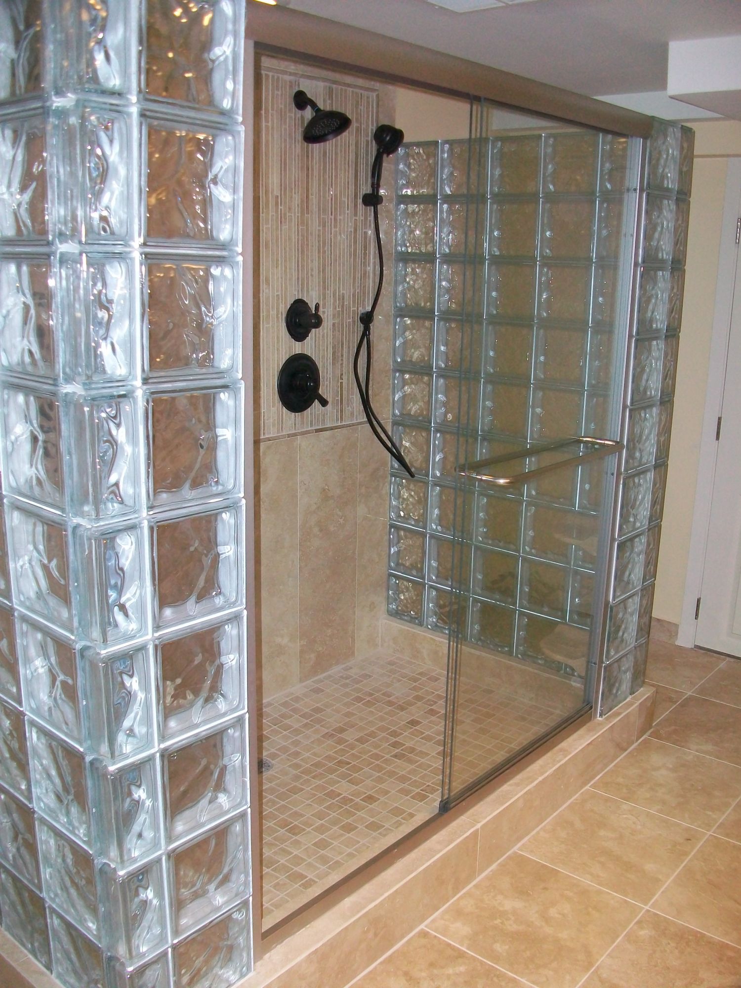 Side angled image of glass showers from bathroom remodel in St. Paul