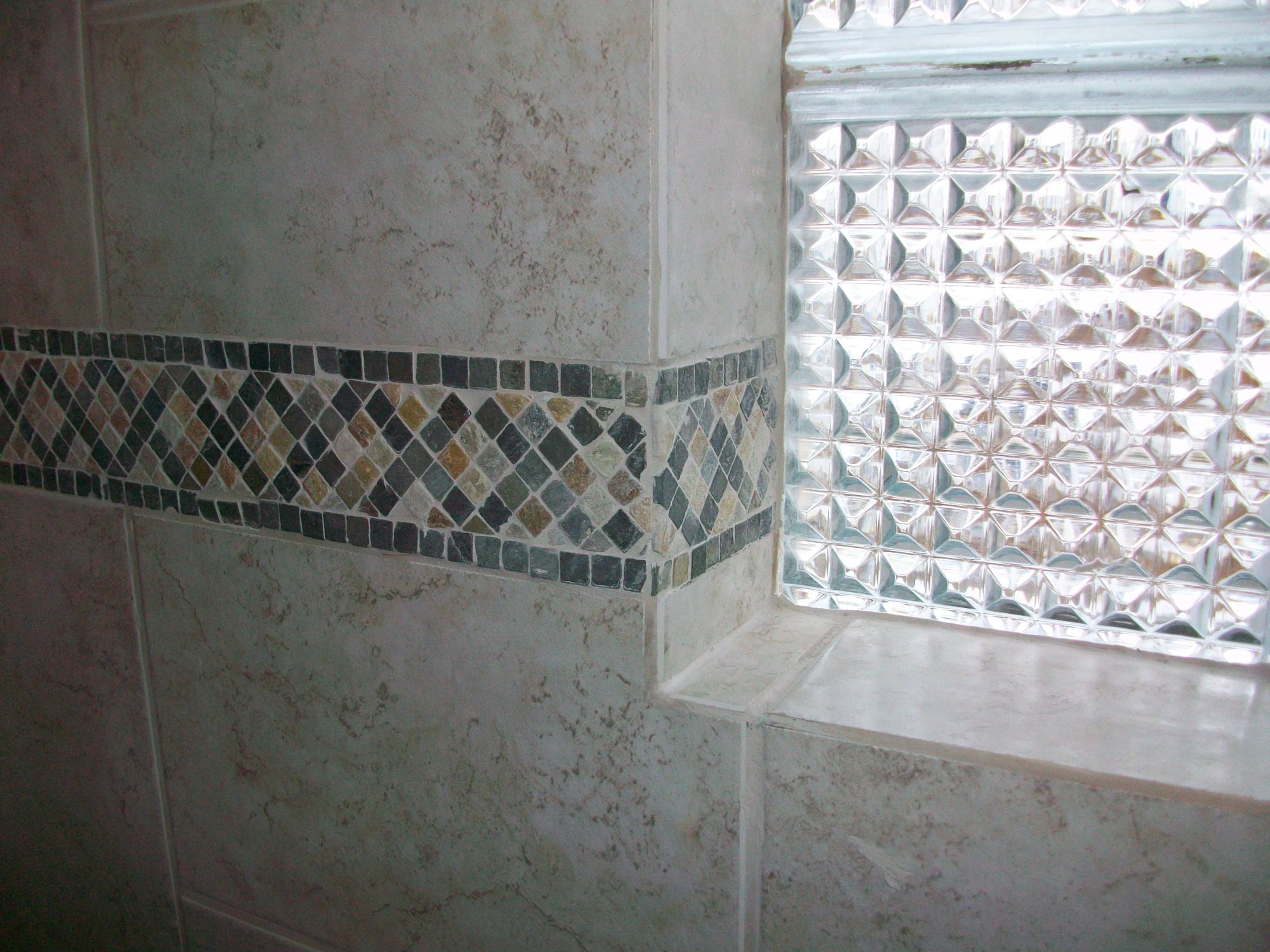 Image of glass and tile work from a bathroom remodel in Minnesota